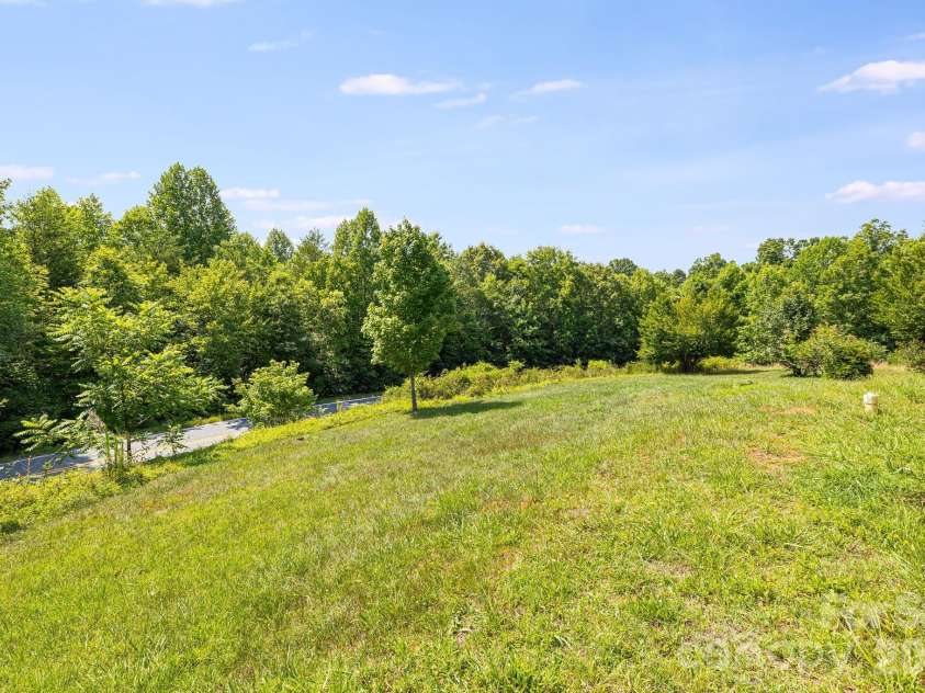 111 Bible School Road, Lake Lure, NC 28746.  MLS# CAR4399262, YatesRealty ID 34637. Front yard view