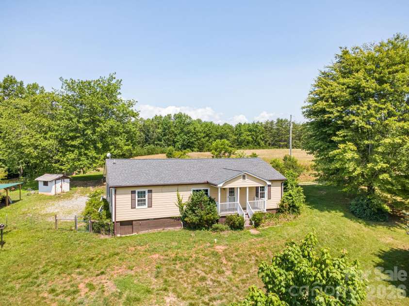 111 Bible School Road, Lake Lure, NC 28746.  MLS# CAR4399262, YatesRealty ID 34637. Home from front yard