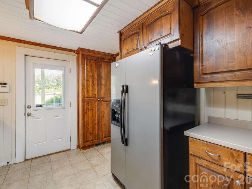 111 Bible School Road, Lake Lure, NC 28746.  MLS# CAR4399262, YatesRealty ID 34637. Kitchen, main entrance