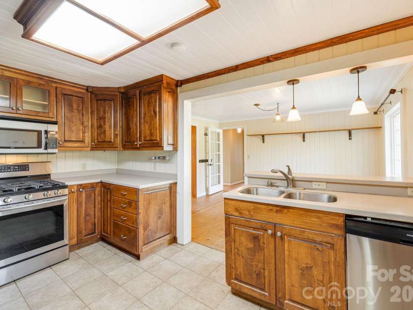 111 Bible School Road, Lake Lure, NC 28746.  MLS# CAR4399262, YatesRealty ID 34637. Kitchen w/ new dishwasher