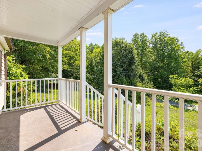 111 Bible School Road, Lake Lure, NC 28746.  MLS# CAR4399262, YatesRealty ID 34637. Porch facing front yard