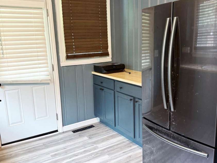 1556 Sam Smith Road, Fort Mill, SC 29708.  MLS# CAR4279108, YatesRealty ID 34638. Kitchen, counters and fridge