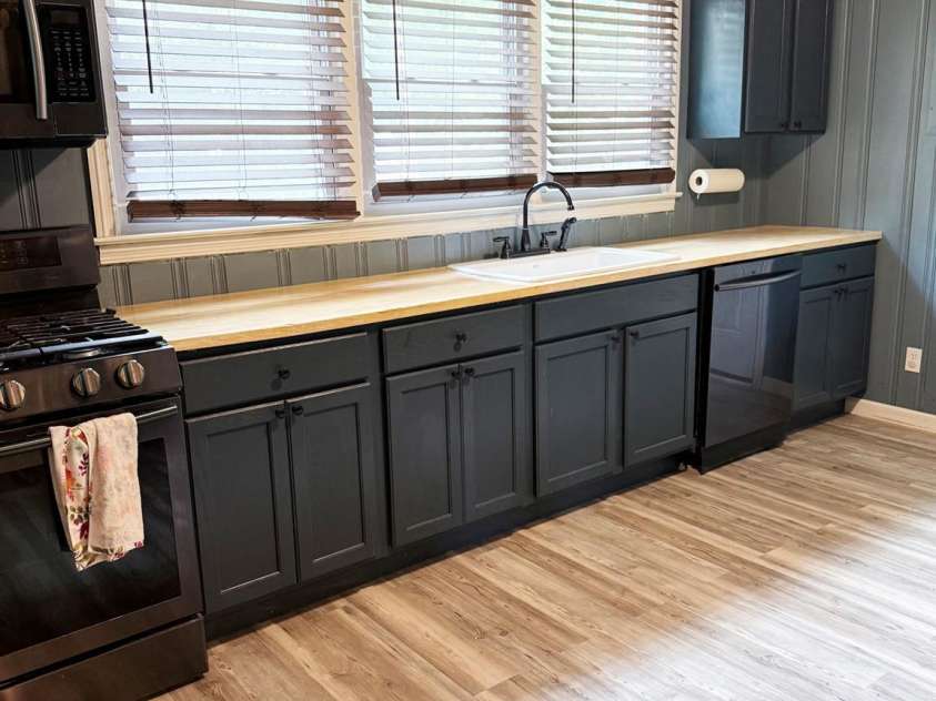 1556 Sam Smith Road, Fort Mill, SC 29708.  MLS# CAR4279108, YatesRealty ID 34638. Kitchen; gas range, microwave, dishwasher, and counter space with sink under windows