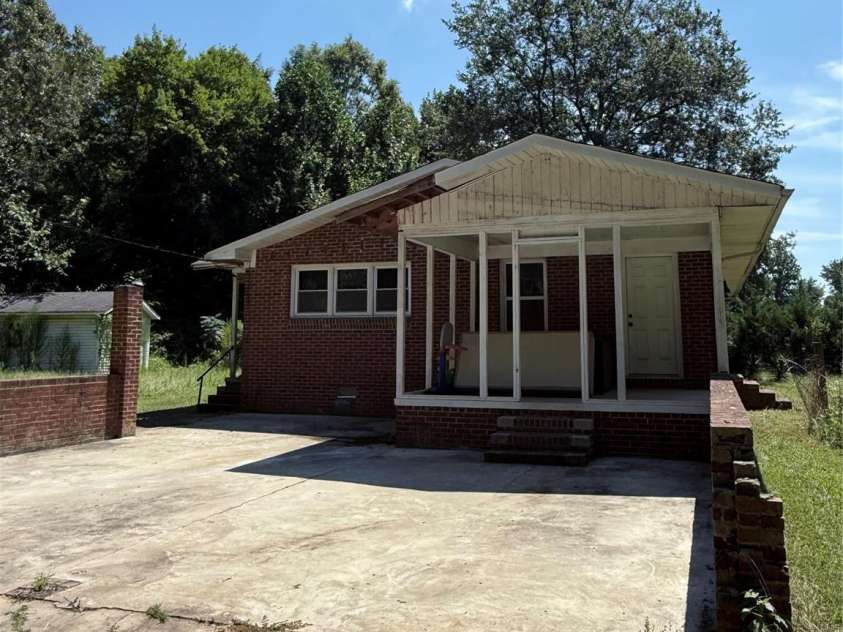 1556 Sam Smith Road, Fort Mill, SC 29708.  MLS# CAR4279108, YatesRealty ID 34638. Parking pad off side porch