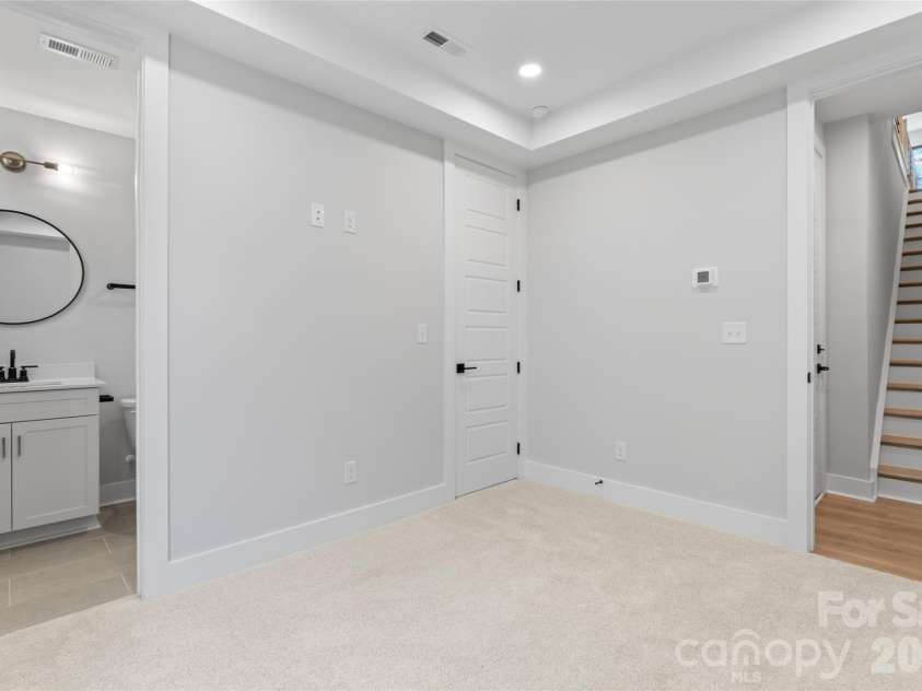 3453 Byrnes Street, Charlotte, NC 28205.  MLS# CAR4329263, YatesRealty ID 3464. Lower Bedroom and Bathroom
