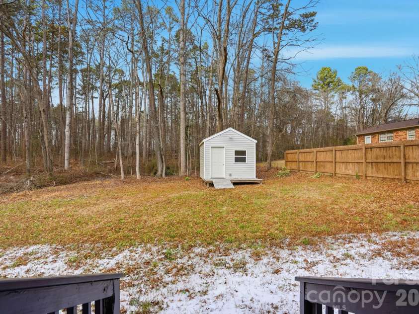 704 Border Street, Dallas, NC 28034.  MLS# CAR4342695, YatesRealty ID 3465. View of the subject back yard 2nd Parcel workshop is located not included