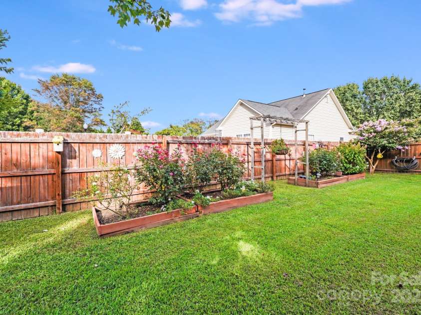 3319 Creek Trail Road, Indian Trail, NC 28079.  MLS# CAR4295633, YatesRealty ID 34657. Beautiful flower beds