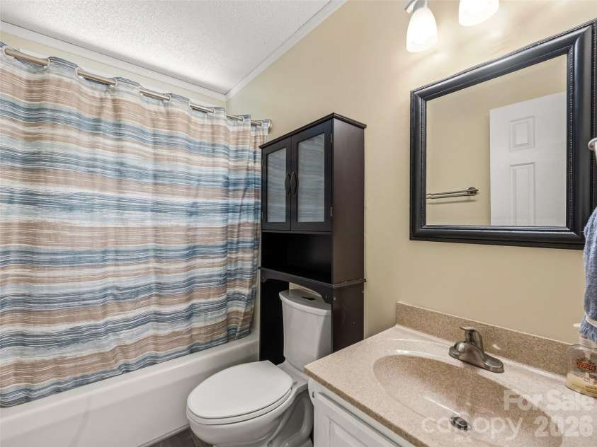 206 Camellia Way, Laurel Park, NC 28739.  MLS# CAR4398729, YatesRealty ID 34662. Full bath on main level between two bedrooms