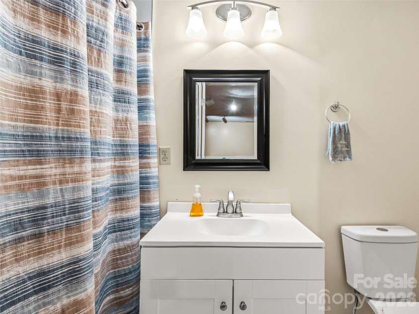 206 Camellia Way, Laurel Park, NC 28739.  MLS# CAR4398729, YatesRealty ID 34662. Lower level bath