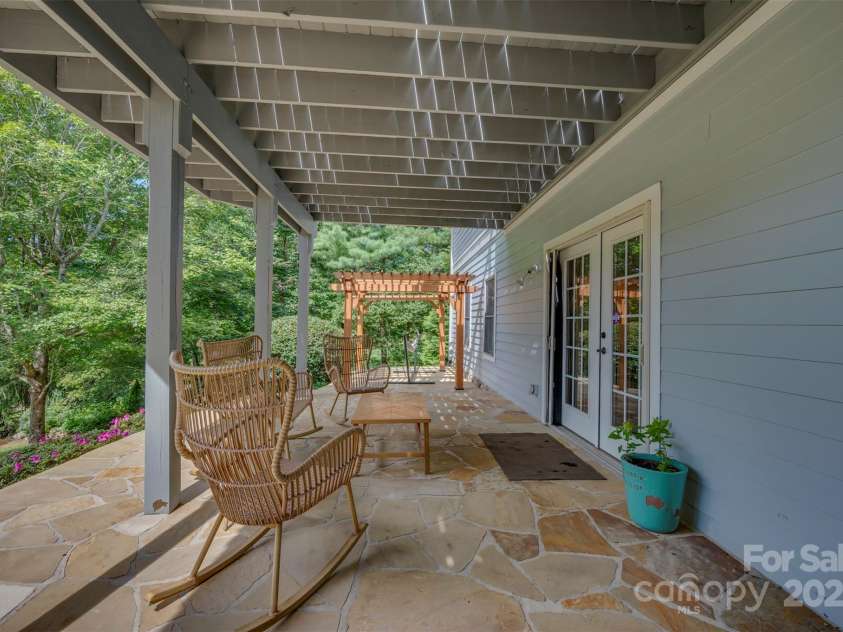 184 Duncan Estate Drive, Fletcher, NC 28732.  MLS# CAR4294135, YatesRealty ID 34666. Entertaining area under the deck
