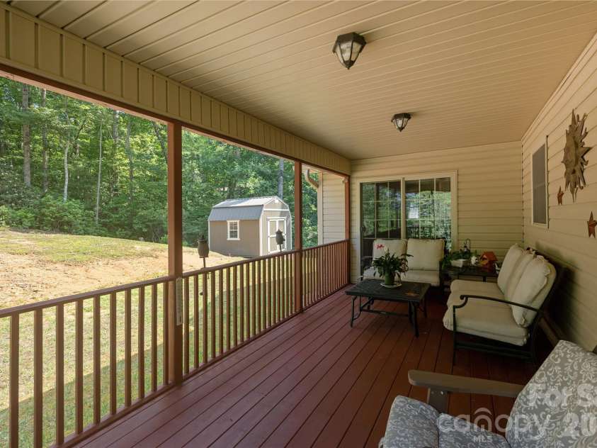59 Smalltown Trail, Brevard, NC 28712.  MLS# CAR4399123, YatesRealty ID 34667. Relax on the covered porch
