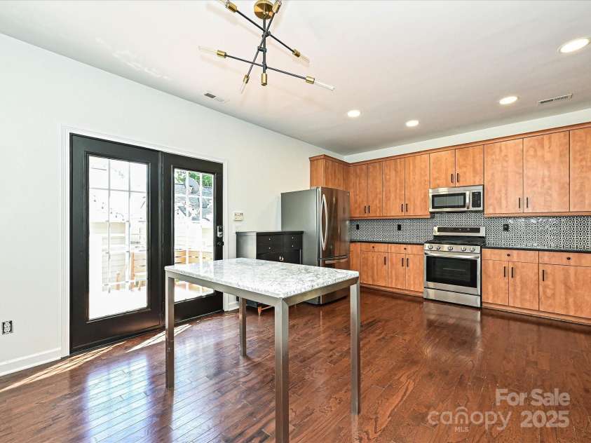 1035 Market Street, Fort Mill, SC 29708.  MLS# CAR4294533, YatesRealty ID 34682. Kitchen to Back Deck