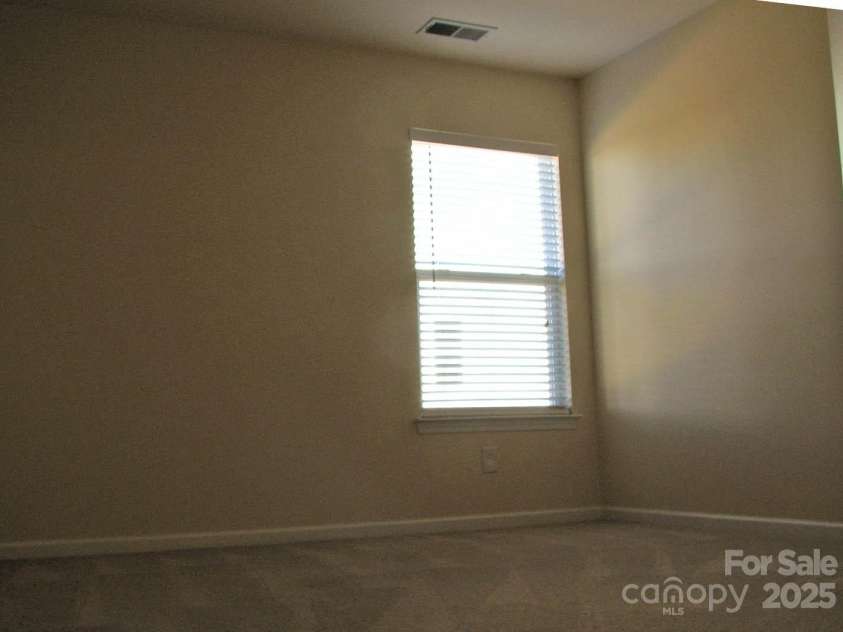 13008 Rothe House Road, Charlotte, NC 28273.  MLS# CAR4296922, YatesRealty ID 34685. Center back bedroom11'9