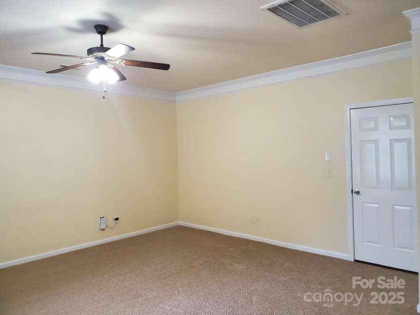13008 Rothe House Road, Charlotte, NC 28273.  MLS# CAR4296922, YatesRealty ID 34685. Den towards garage18'11