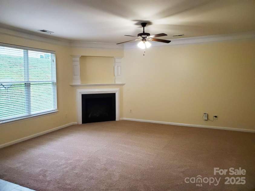 13008 Rothe House Road, Charlotte, NC 28273.  MLS# CAR4296922, YatesRealty ID 34685. Den with gas log fireplace