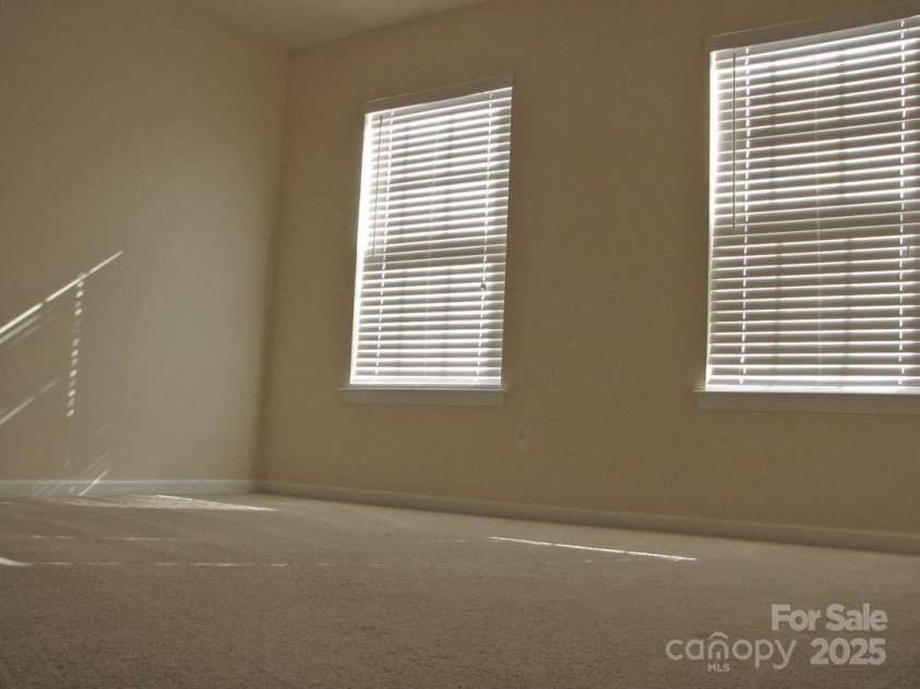 13008 Rothe House Road, Charlotte, NC 28273.  MLS# CAR4296922, YatesRealty ID 34685. Front Bedroom12'8