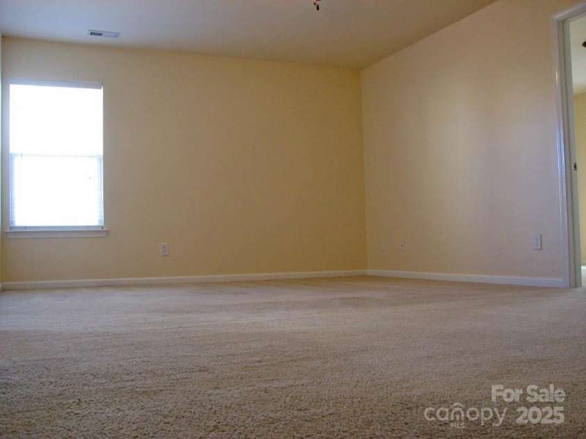 13008 Rothe House Road, Charlotte, NC 28273.  MLS# CAR4296922, YatesRealty ID 34685. Loft at top of stairs18'9