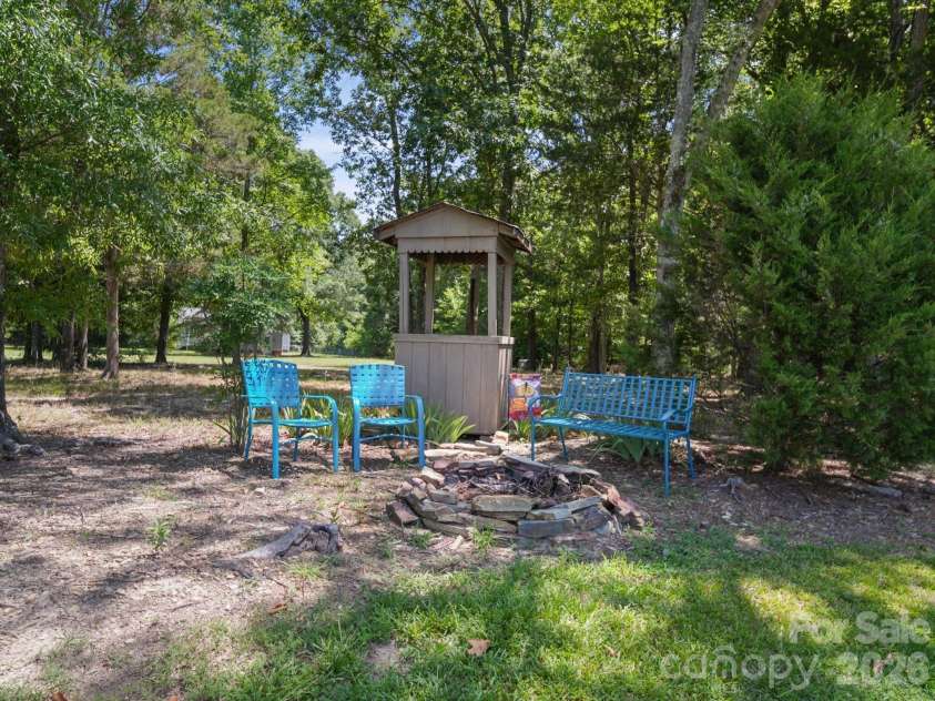 24794 NC 24/27 Highway, Albemarle, NC 28001.  MLS# CAR4398147, YatesRealty ID 34689. Wooded Area with Firepit Area