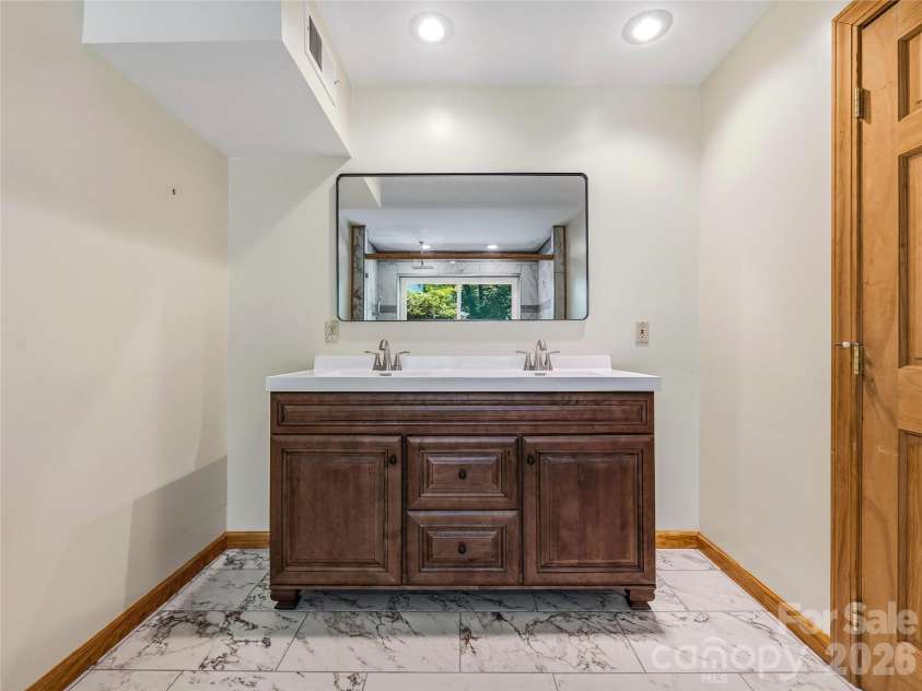 1856 Lickskillet Road, Burnsville, NC 28714.  MLS# CAR4396604, YatesRealty ID 34698. Lower floor bathroom