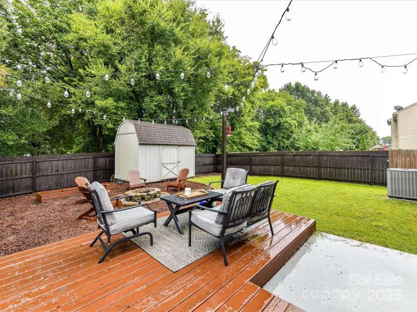 355 Pulaski Drive, Concord, NC 28027.  MLS# CAR4287941, YatesRealty ID 34699. Back Yard Area off of Living Room