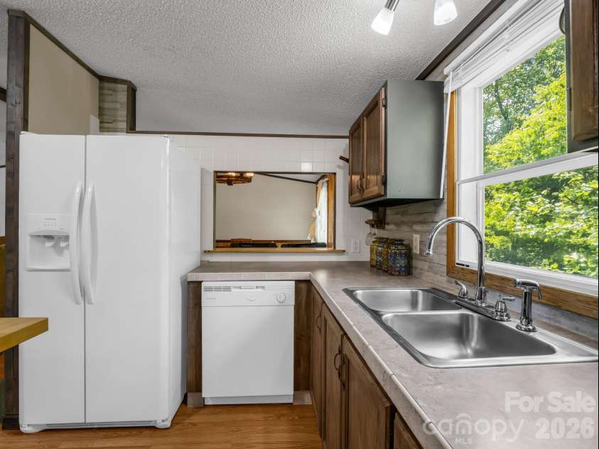 2053 Nancy Mountain Road, Rosman, NC 28772.  MLS# CAR4381811, YatesRealty ID 347. Kitchen and breakfast bar