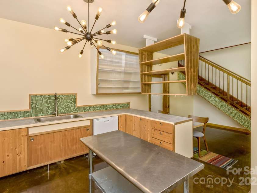 117 Old Dairy Drive, Leicester, NC 28748.  MLS# CAR4291419, YatesRealty ID 34700. Recently updated with new countertops, the sleek cabinet design is very modern with a European feel.