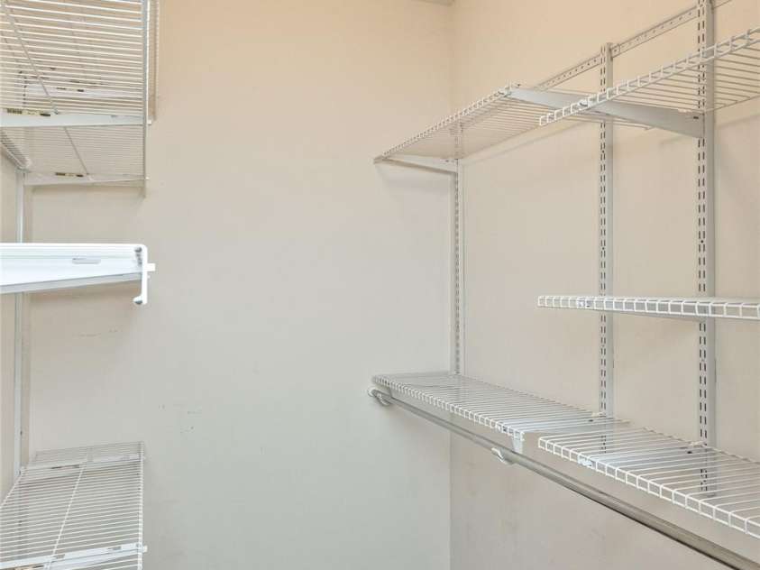 117 Old Dairy Drive, Leicester, NC 28748.  MLS# CAR4291419, YatesRealty ID 34700. The walk-in closet in Bedroom One features adjustable shelving to suit various storage configurations.