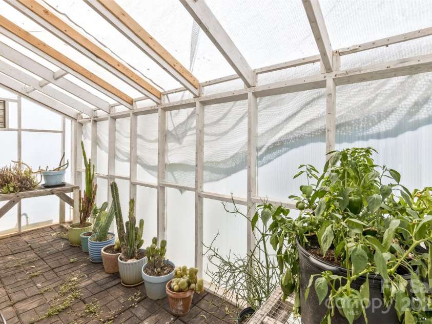117 Old Dairy Drive, Leicester, NC 28748.  MLS# CAR4291419, YatesRealty ID 34700. To complete the possibilities of gardening on your homestead, the newly re-covered greenhouse is perfect for getting a jumpstart on your spring plantings.
