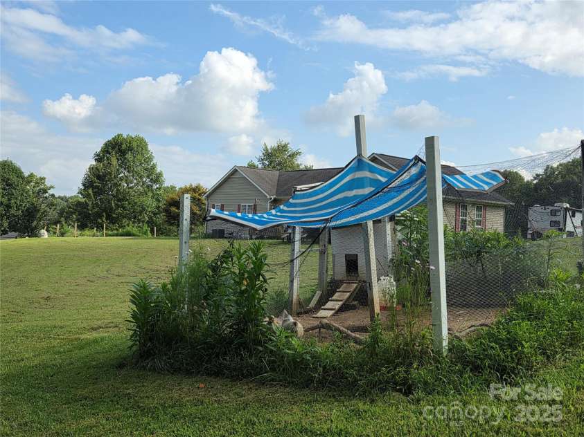 21 Persimmon Drive, Mills River, NC 28759.  MLS# CAR4289280, YatesRealty ID 34706. Chickens Welcome!
