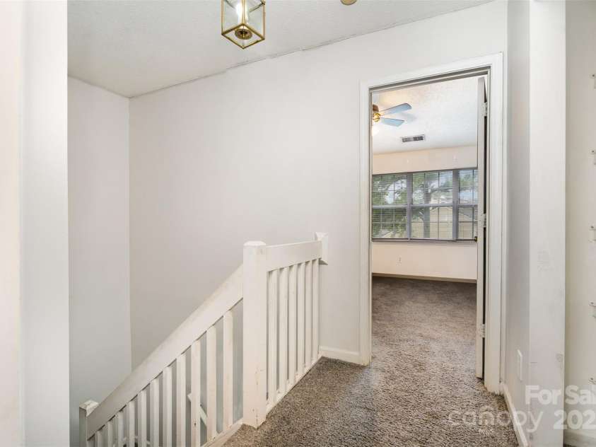 5921 Cougar Lane, Charlotte, NC 28269.  MLS# CAR4291089, YatesRealty ID 34708. Walkway to bedrooms