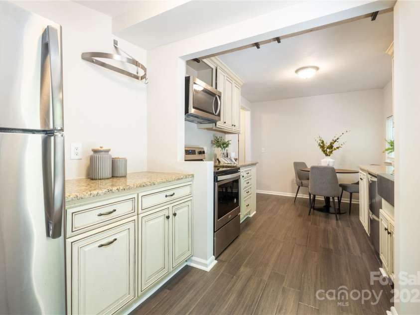 1325 Shamrock Drive, Charlotte, NC 28205.  MLS# CAR4285688, YatesRealty ID 34710. Kitchen - all staging decor has been removed. 