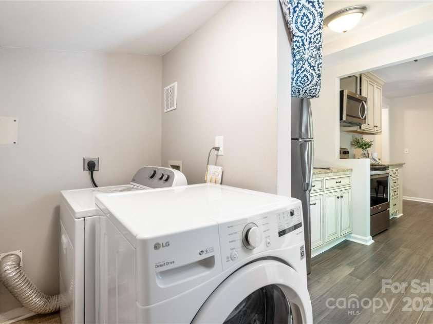 1325 Shamrock Drive, Charlotte, NC 28205.  MLS# CAR4285688, YatesRealty ID 34710. Laundry is located at the end of the kitchen