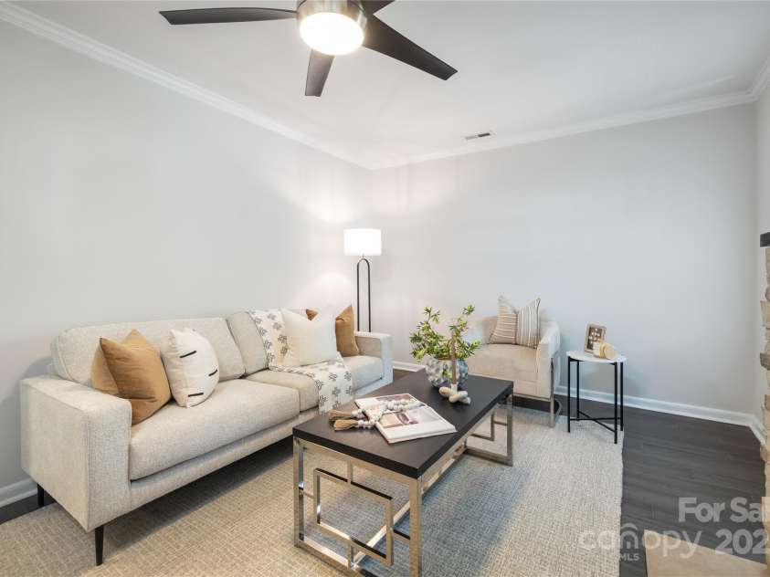 1325 Shamrock Drive, Charlotte, NC 28205.  MLS# CAR4285688, YatesRealty ID 34710. Living Room before staging was removed. 