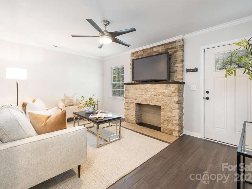 1325 Shamrock Drive, Charlotte, NC 28205.  MLS# CAR4285688, YatesRealty ID 34710. Living Room - Fireplace sold AS-IS.  No know issues.