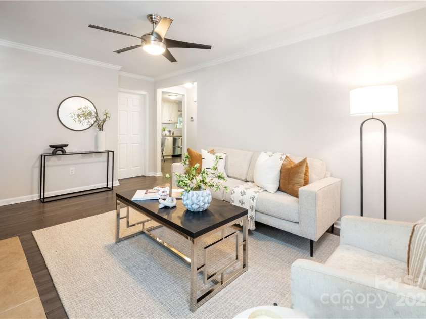 1325 Shamrock Drive, Charlotte, NC 28205.  MLS# CAR4285688, YatesRealty ID 34710. Living Room prior to staging removal. 