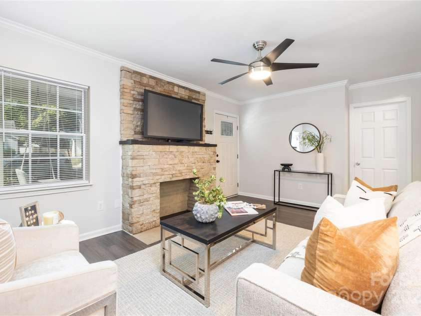 1325 Shamrock Drive, Charlotte, NC 28205.  MLS# CAR4285688, YatesRealty ID 34710. Living Room prior to staging removal. 