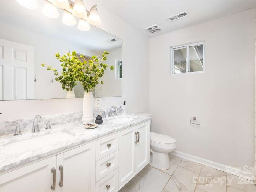 1325 Shamrock Drive, Charlotte, NC 28205.  MLS# CAR4285688, YatesRealty ID 34710. Updated full bath prior to staging removal. 