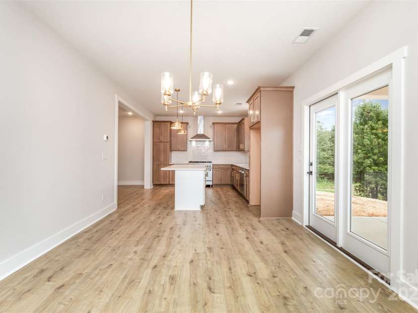 2822 Molly Pop Lane, Monroe, NC 28112.  MLS# CAR4272441, YatesRealty ID 34715. Dining to back patio and kitchen