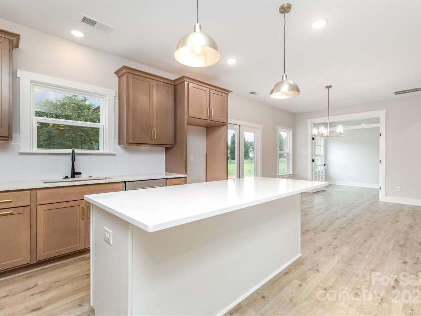 2822 Molly Pop Lane, Monroe, NC 28112.  MLS# CAR4272441, YatesRealty ID 34715. Kitchen into dining