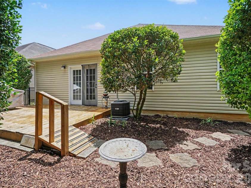 9640 Storybook Avenue, Concord, NC 28027.  MLS# CAR4396872, YatesRealty ID 34715. Backyard and deck