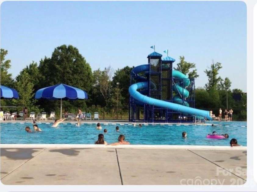 9640 Storybook Avenue, Concord, NC 28027.  MLS# CAR4396872, YatesRealty ID 34715. Community waterslide