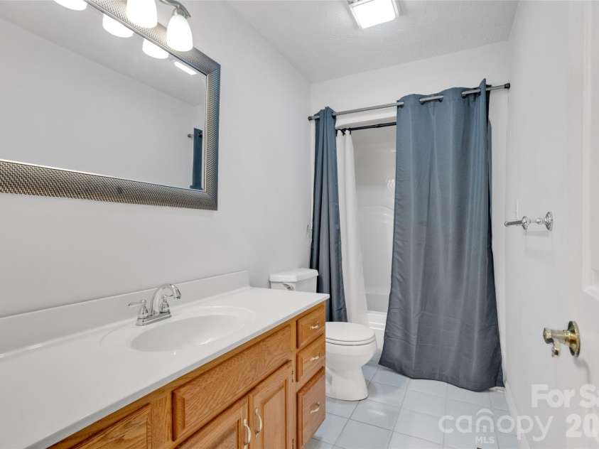 117 Caldonia Drive, Candler, NC 28715.  MLS# CAR4397414, YatesRealty ID 34717. Guest bathroom