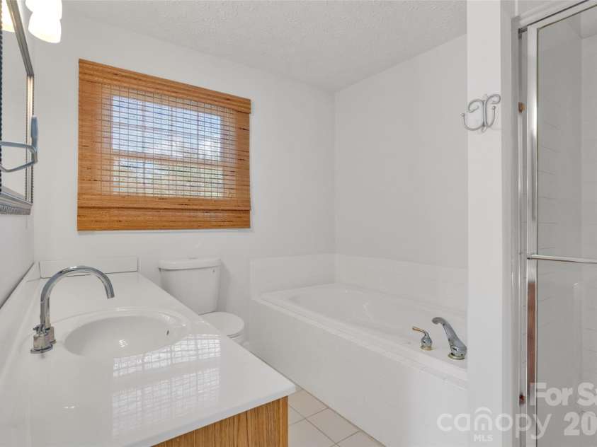 117 Caldonia Drive, Candler, NC 28715.  MLS# CAR4397414, YatesRealty ID 34717. Primary bathroom