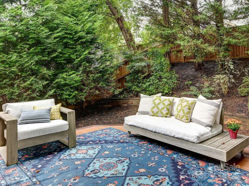 1343 Heathbrook Circle, Asheville, NC 28803.  MLS# CAR4293968, YatesRealty ID 34717. Back deck sitting area