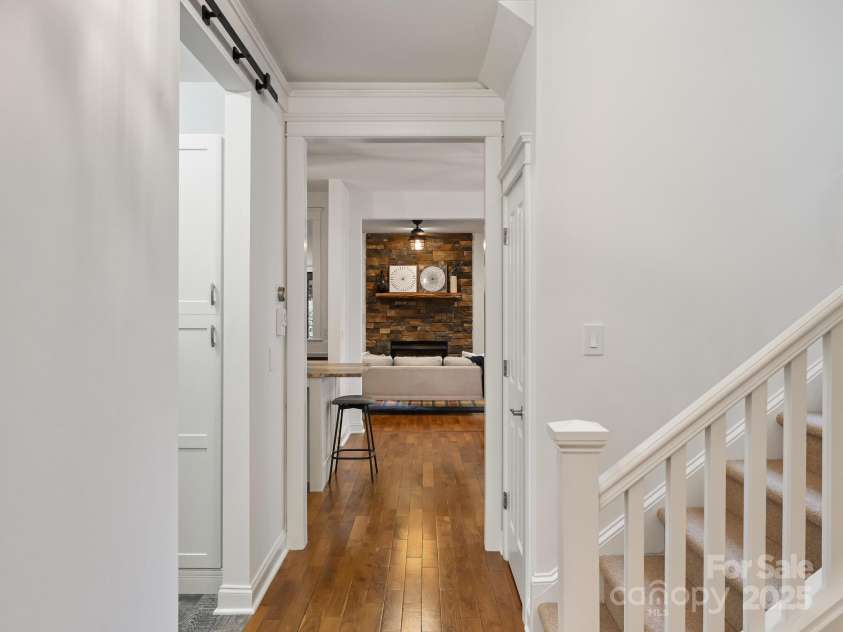 1343 Heathbrook Circle, Asheville, NC 28803.  MLS# CAR4293968, YatesRealty ID 34717. Hallway with stairs to upper level