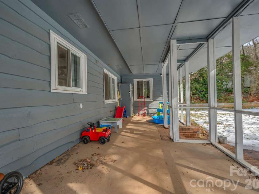 1685 Lynn Road, Columbus, NC 28722.  MLS# CAR4341868, YatesRealty ID 3472. Large back porch is framed and ready to be screened in for your summer enjoyment.