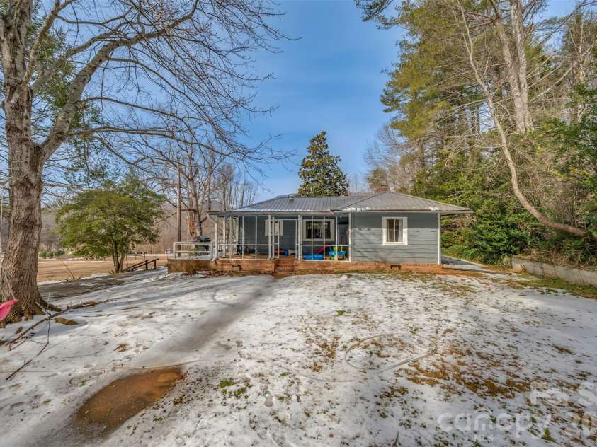 1685 Lynn Road, Columbus, NC 28722.  MLS# CAR4341868, YatesRealty ID 3472. Nice backyard and sidewalk lead to the parking area 