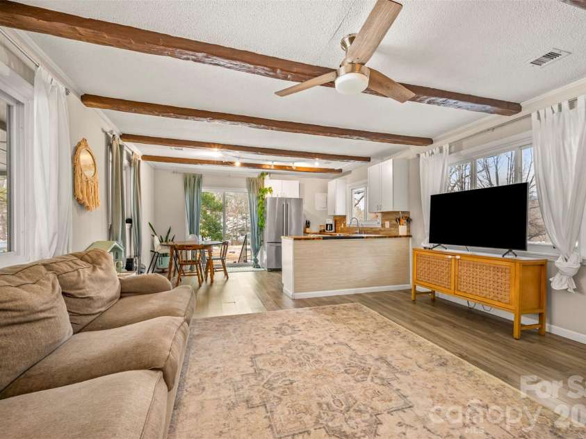 1685 Lynn Road, Columbus, NC 28722.  MLS# CAR4341868, YatesRealty ID 3472. Open plan living room, dining area, and kitchen