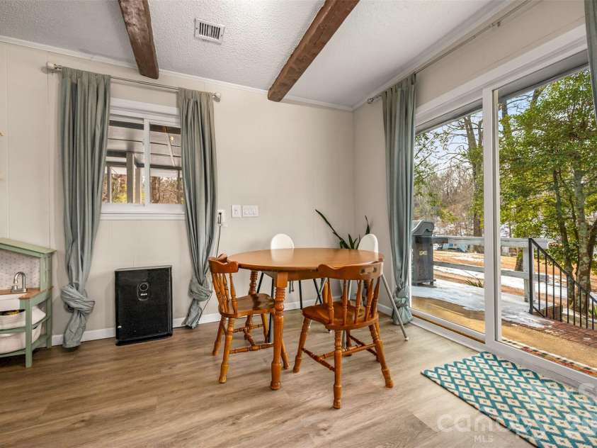 1685 Lynn Road, Columbus, NC 28722.  MLS# CAR4341868, YatesRealty ID 3472. Sliding glass door leads to side porch and lets in so much natural light.