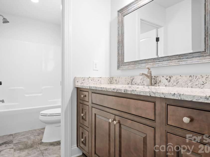 115 Buckingham Place Road, Mooresville, NC 28115.  MLS# CAR4373957, YatesRealty ID 34725. J & J Bath shared between 3 & 4